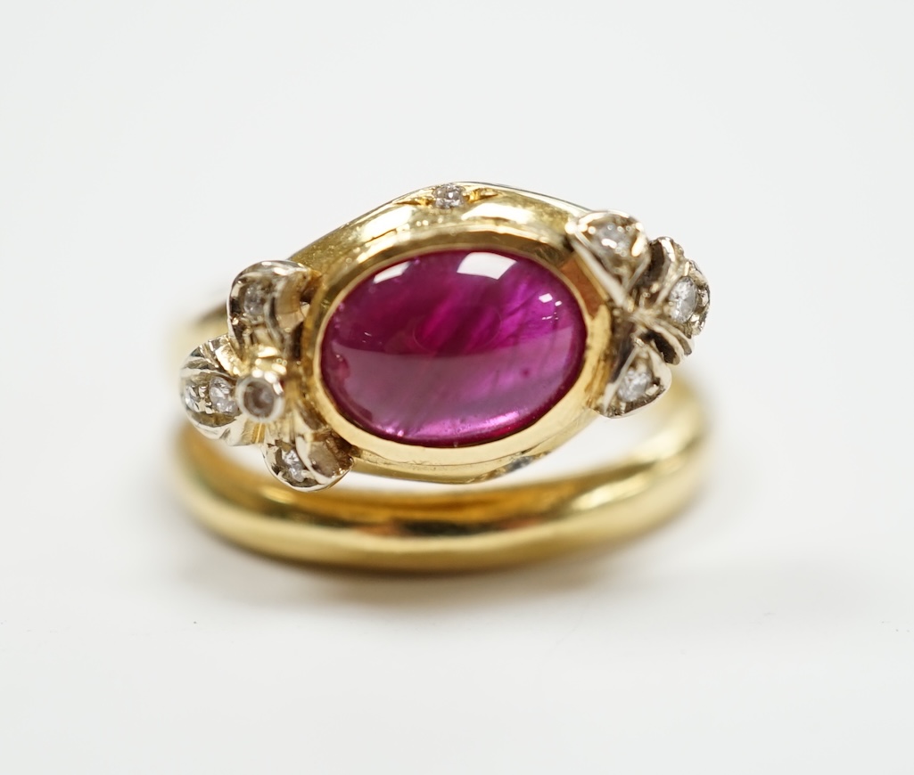 A modern Italian 750, synthetic cabochon ruby and diamond chip set coil shank dress ring, size J/K, gross weight 6.9 grams.